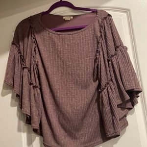 Purple shirt with ruffle sleeves